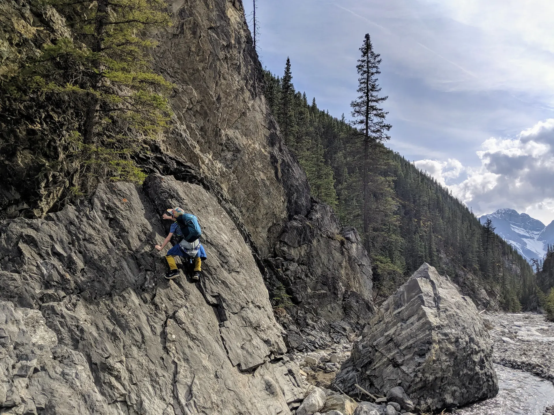 A boy bouldering in Cougar Canyon, Alberta. Bad parenting? Or "nature bathing"?